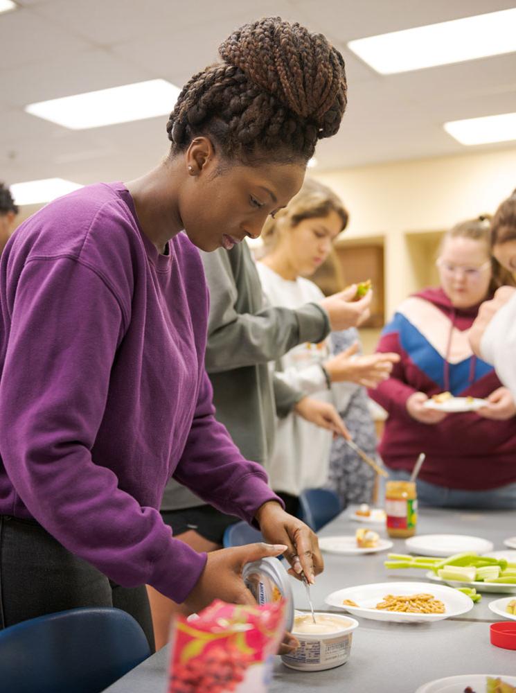 Students work on a snack project in the Burkhiser Complex